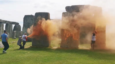 Climate Activists Throw Orange Paint Over the Historic Monument of Stonehenge